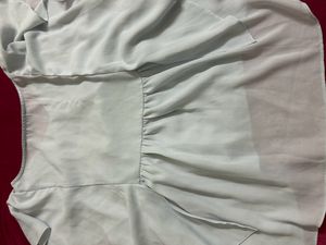 light blue frilled top