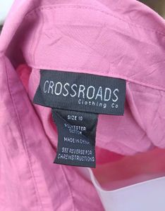 Pink Sleeveless Button-Down