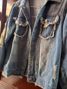 ripped denim jacket with sequins