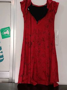 This is a  Red Dress With Unique Pattern Designs