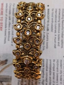 Stunning Gold-Toned Bangle Bracelet with Faux Diam
