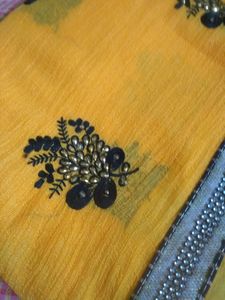 Elegant Yellow Saree With Beautiful Black And Silver Border