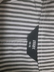An Elegant Dress With Grey Stripes On White Base