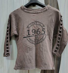 A Brown Top With Sleeves Detailing