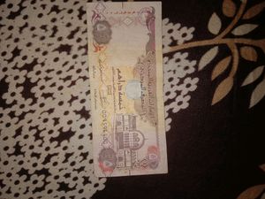 1 Doller USA Currency And 5 Dirhams