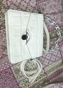 white hand purse