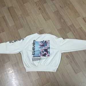 Cream Cropped Sweatshirt.