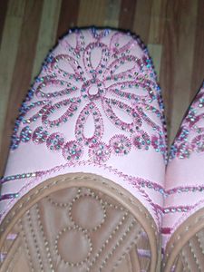 pair of traditional pink embroidered juttis