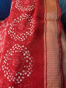 Red synthetic saree with blouse