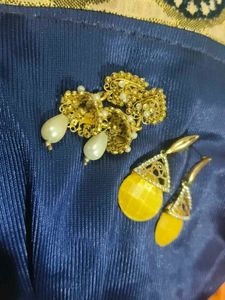 White Earrings Amd Golden Jhumkas.
