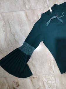 A dark green , full sleeve top