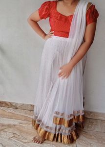 White Net Lehanga And Red Prince Cut Blouse