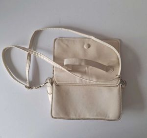 Light Pink Handbag and cream Slingbag