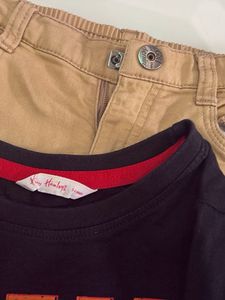 one black T-shirt with beige trousers