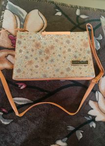 golden colour sling bag