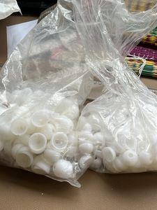 Four White Spherical Beads with Holes