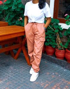 a pink cargo style joggers.