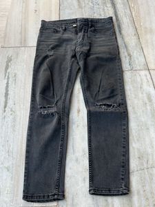 Distressed grey jeans