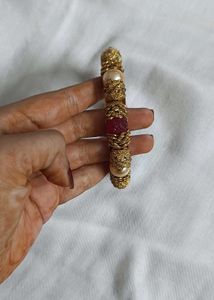 Gold-tone Bangle.