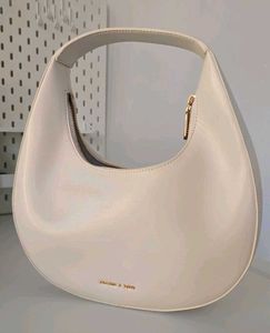 CHARLES &amp; KEITH Cream Philomena Half-Moon Bag