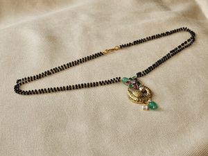 A New Black Bead Chain With Peacock Lovket