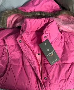 Brand new pink sleeveless jacket with hoodie
