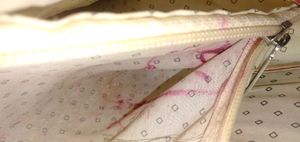 Combo for asma. Pink sling sturdy bag. used a few times. slight stains on the inside. working zips and in good condition