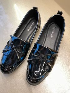 new bright shiny black westside loafers