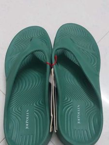 Branded Green flip-flops