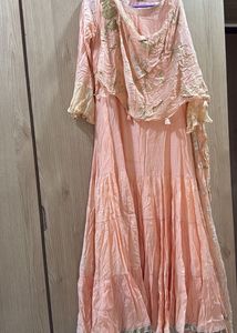 peach gown with cowl and attached drape
