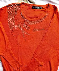 Sparkling Orange sweater.