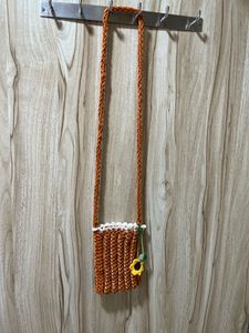 A Beautiful Crochet Handmade Mobile Sling Bag.