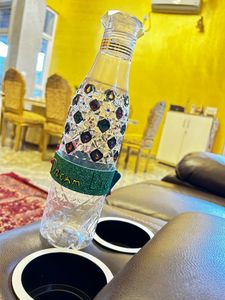 Crystallized designer plastic bottle