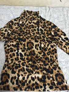 A Leopard Print Turtle Neck Fitted Top