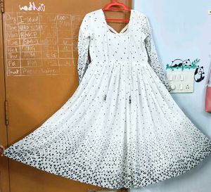 White frock with black dots design..