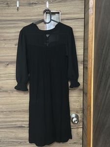 Chic Black Dress with Sheer Sleeves
