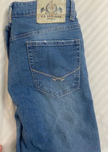 Light blue denim jeans with a cool distressed look