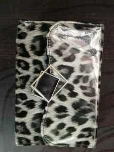 This Is A Sling Bag It Has Cheetah Print