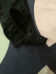 Black Ruffle Tube Bodysuit From NEWME