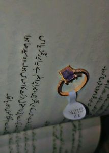 Elegant rose gold ring with a lavender stone.