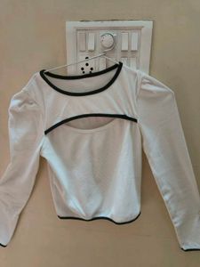 A white cut-out long sleeve crop top