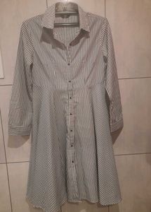 An Elegant Dress With Grey Stripes On White Base