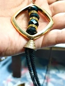 Long Neck Piece And Black Earrings