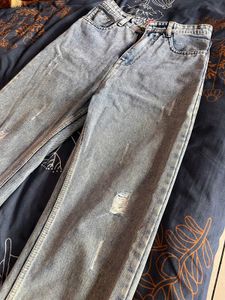 Ripped Light Wash Denim Jeans