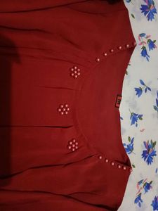 Burgundy blouse with pearl detail