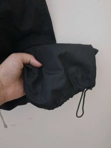 Black parachute pants