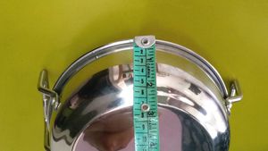 Combo of steel kadhai and milk container.
