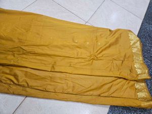 Elegant Mustard Saree with Gold Border