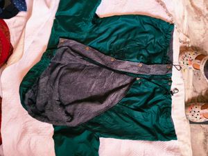 Green hooded windbreaker