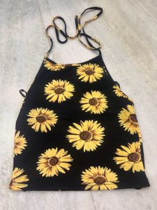 halter neck crop top featuring a vibrant sunflower